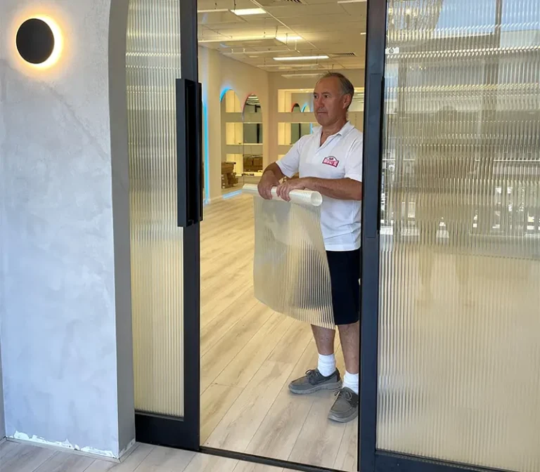 Installing decorative window frosting for a commercial shopfront